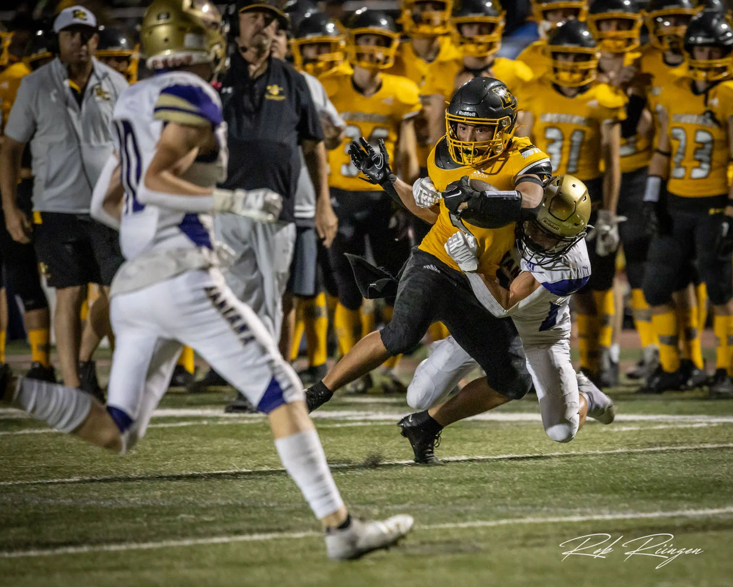 WR getting tackled by a defender