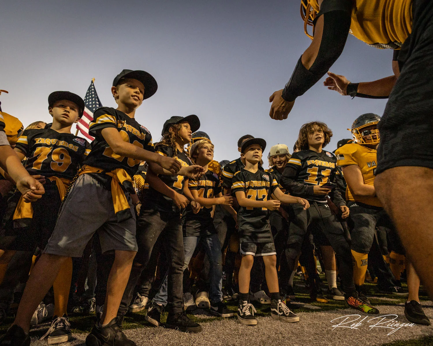 Young players and Vazueros players getting ready for the game